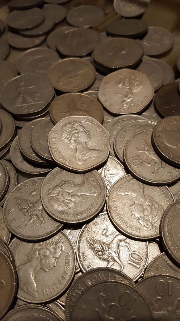 Old"new" 10 pence and 50 pence coins.